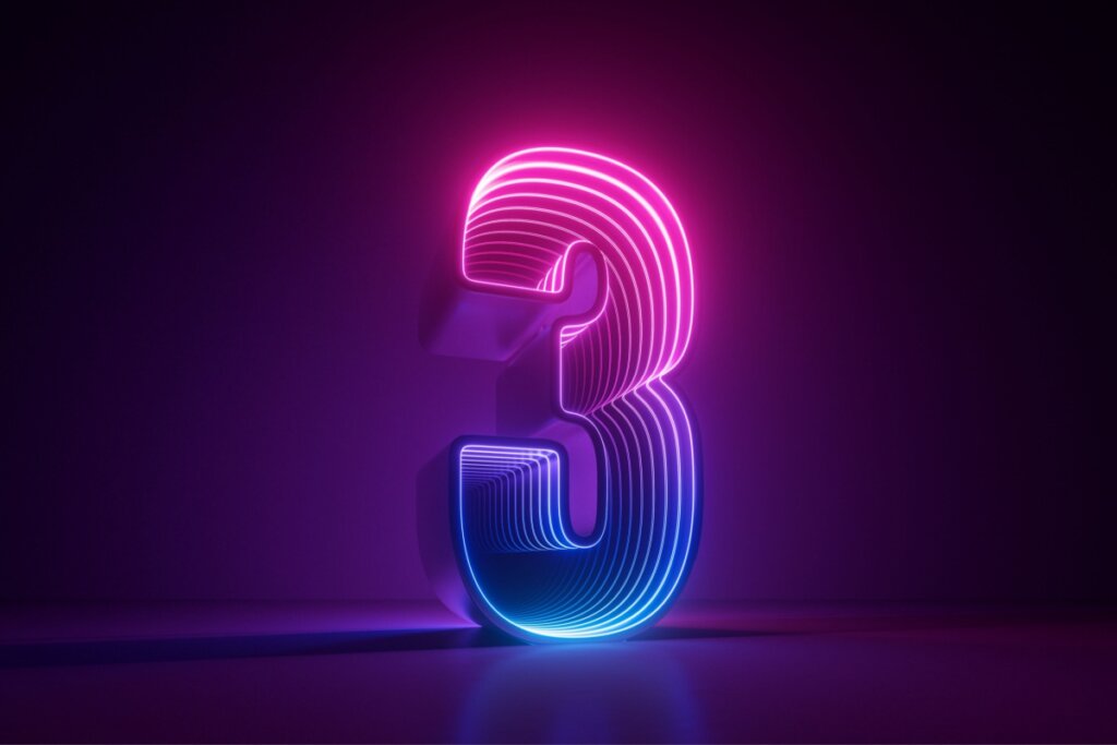 Veja como usar a numerologia para escolher o dia do seu casamento 41 Ilustração do número três em rosa e azul em um fundo preto