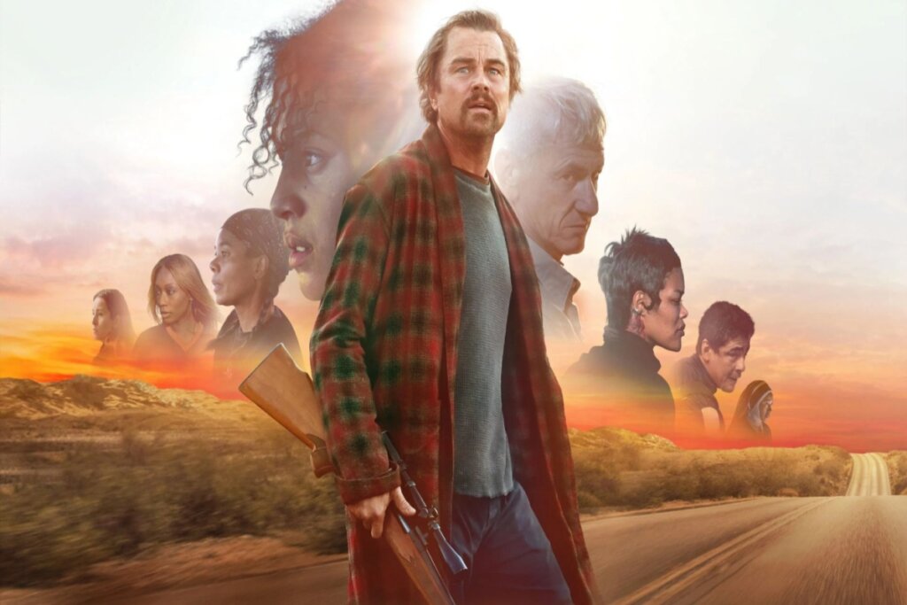 Oscar 2026: 5 filmes que você precisa assistir antes da premiação 20 Capa do filme "Uma Batalha Após a Outra", com o protagonista no centro de uma paisagem agro, usando uma camisa xadrez, e pessoas ao fundo do seu lado