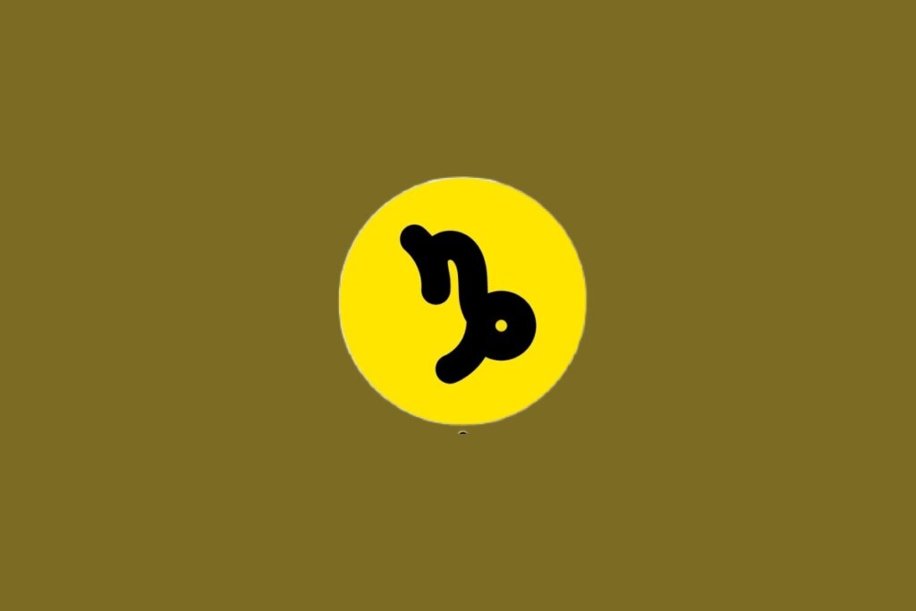 Ilustração do signo de Capricórnio, contendo glifo preto curvo lembrando “n” com laçada final, em círculo amarelo, em um fundo marrom